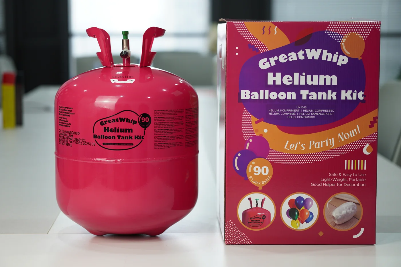 22L GreatWhip helium cylinder beside its printed retail box